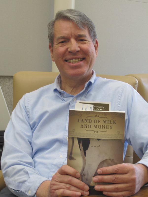 Anthony Barcellos proudly holds his copy of Land of Milk and Money in 2012.